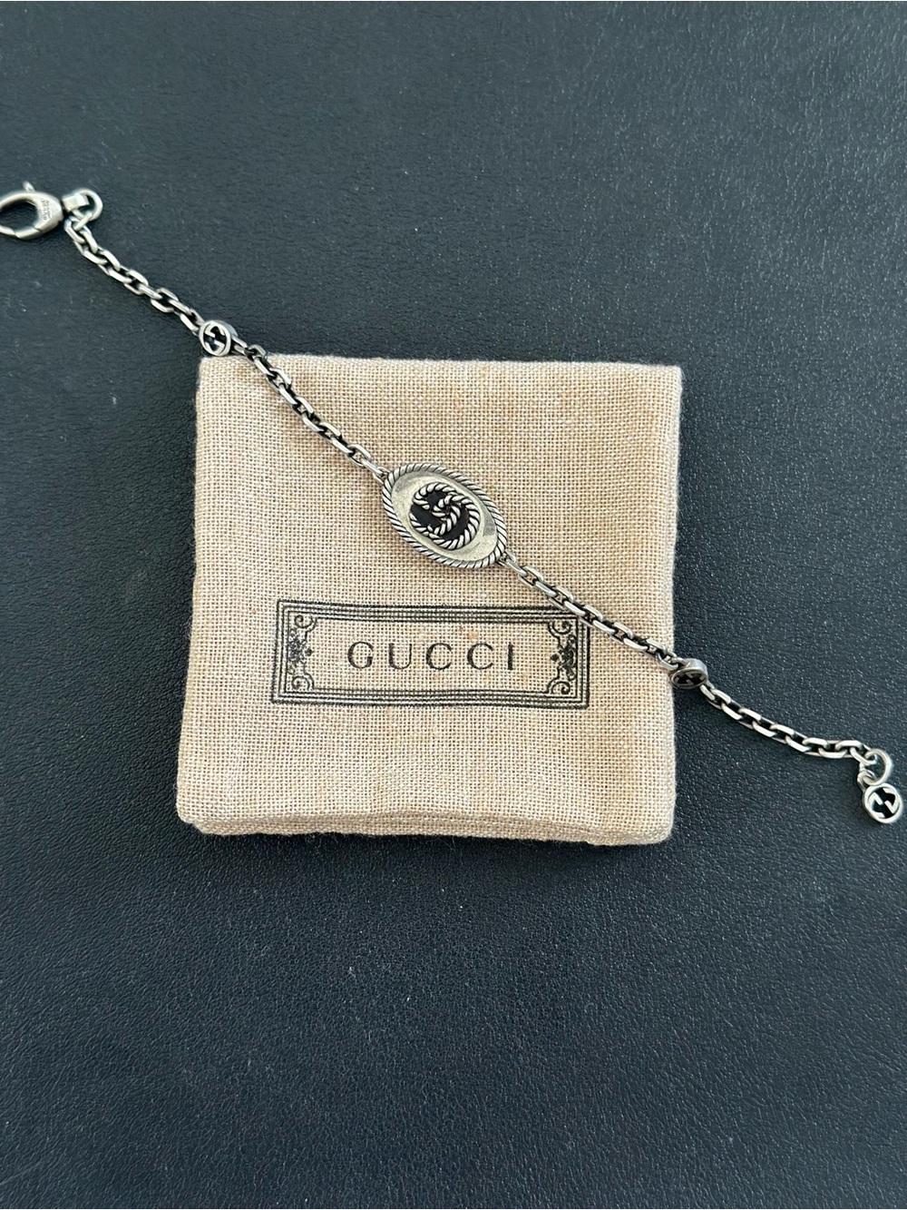 Gucci Sterling Silver Chain Bracelet with Black Emblem
